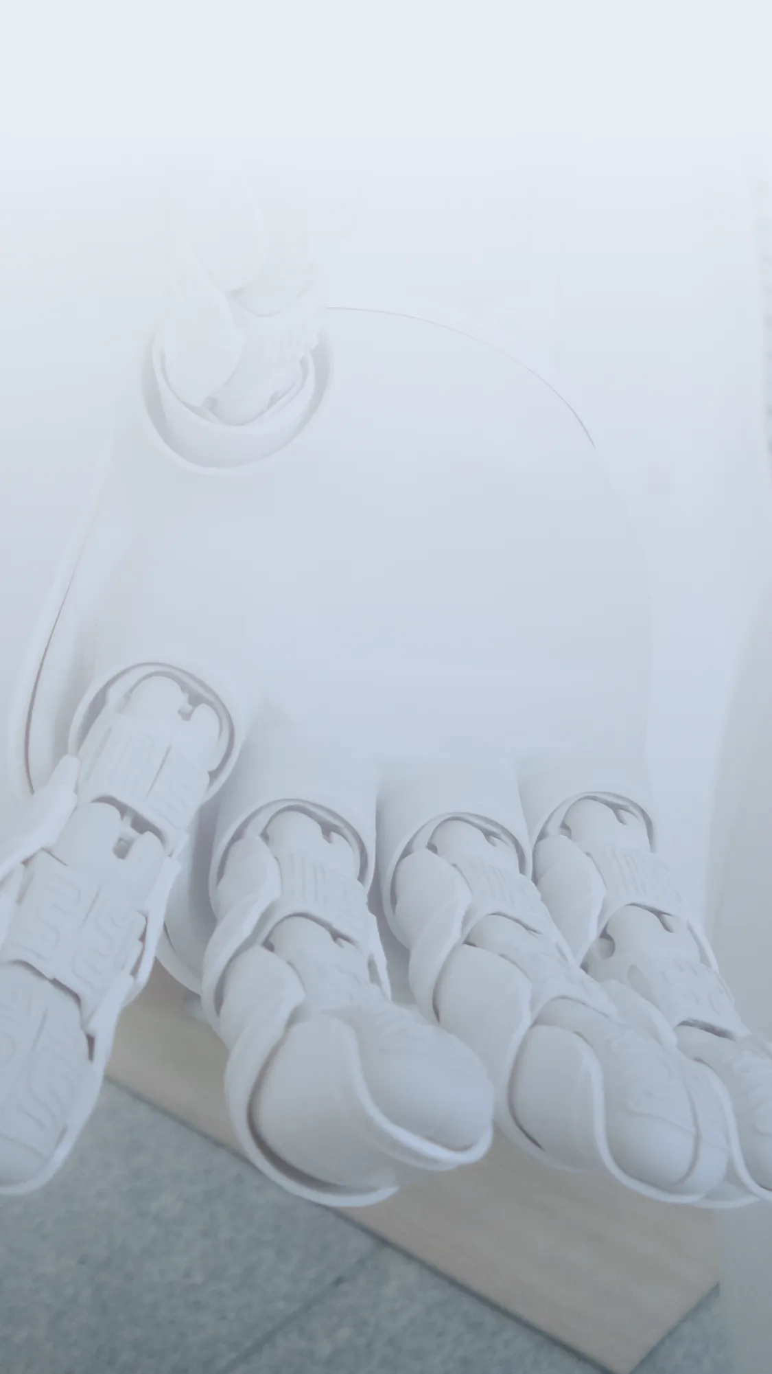 Close-up of a robotic hand with articulated fingers in a futuristic design.
